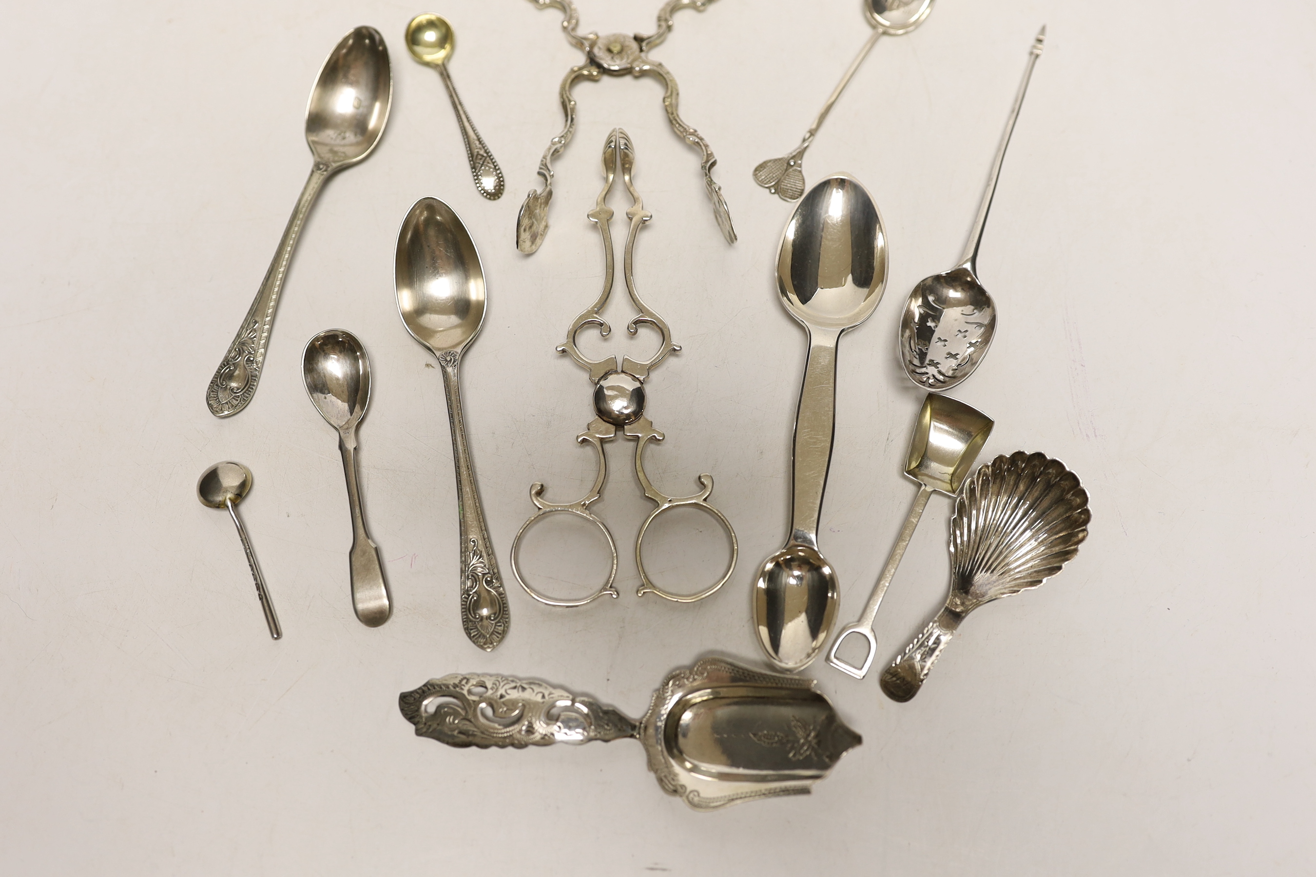 A small quantity of assorted silver flatware etc. including spoons, caddy spoon, condiment spoons, 18th century mote spoon and two pairs of sugar nips.
